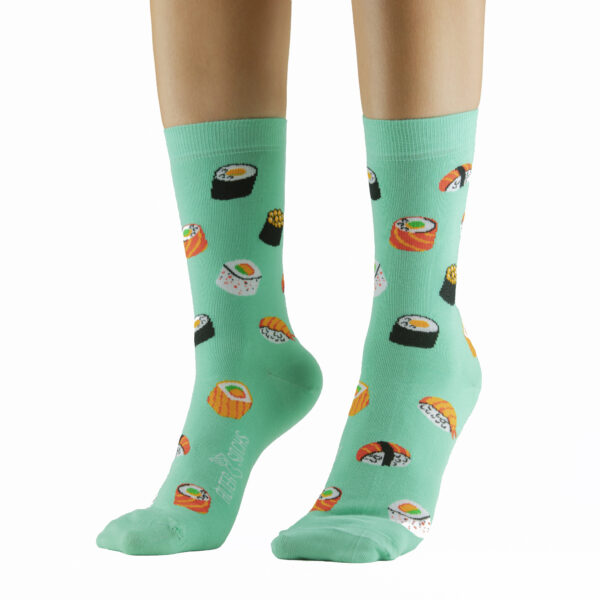 Chaussettes rigolotes avec motif sushi sur fond vert, pour une touche d'originalité.